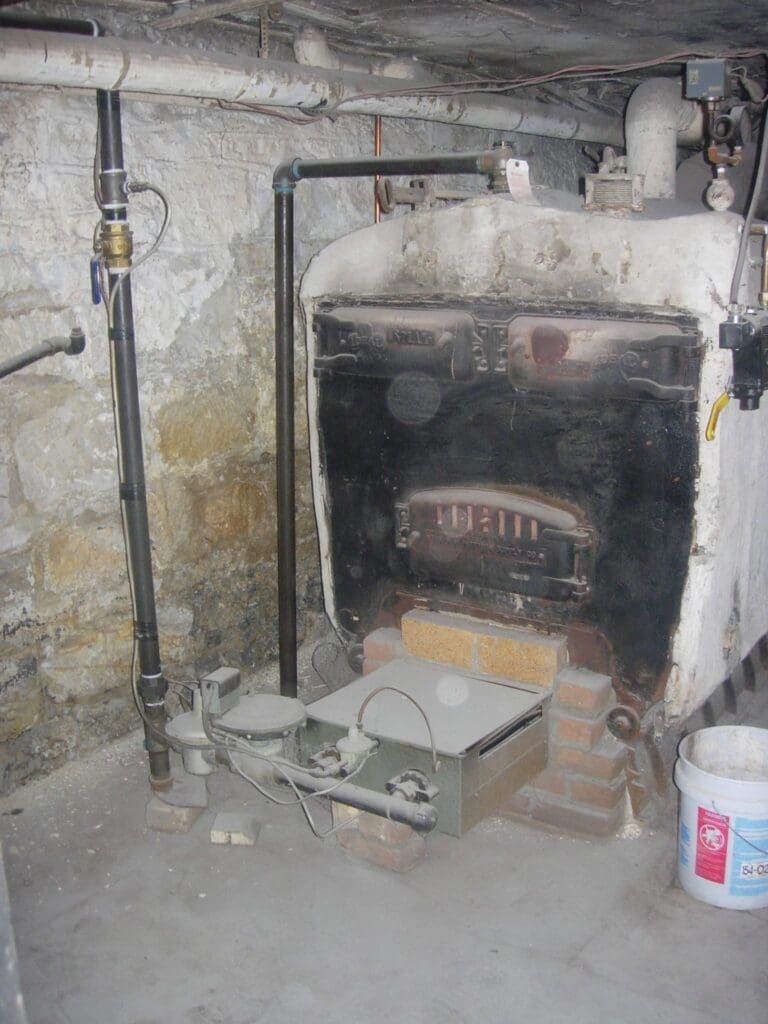 an old boiler sits in a basement of a home