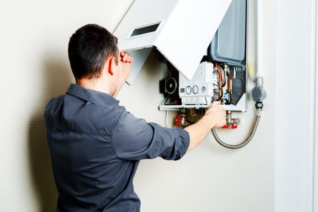 a technician is repairing boiler