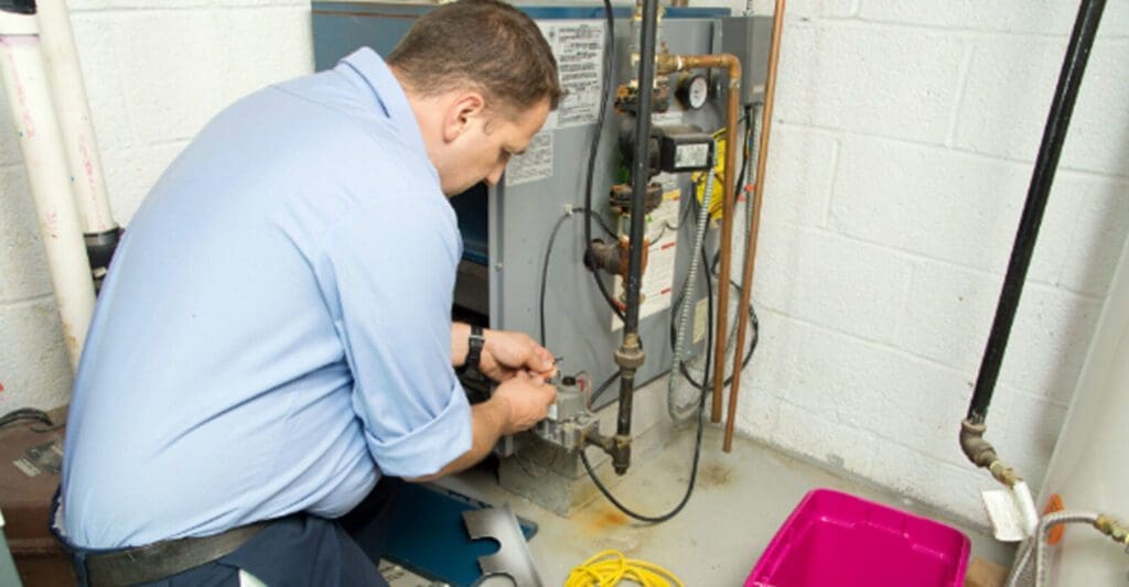 a person is repairing furnace