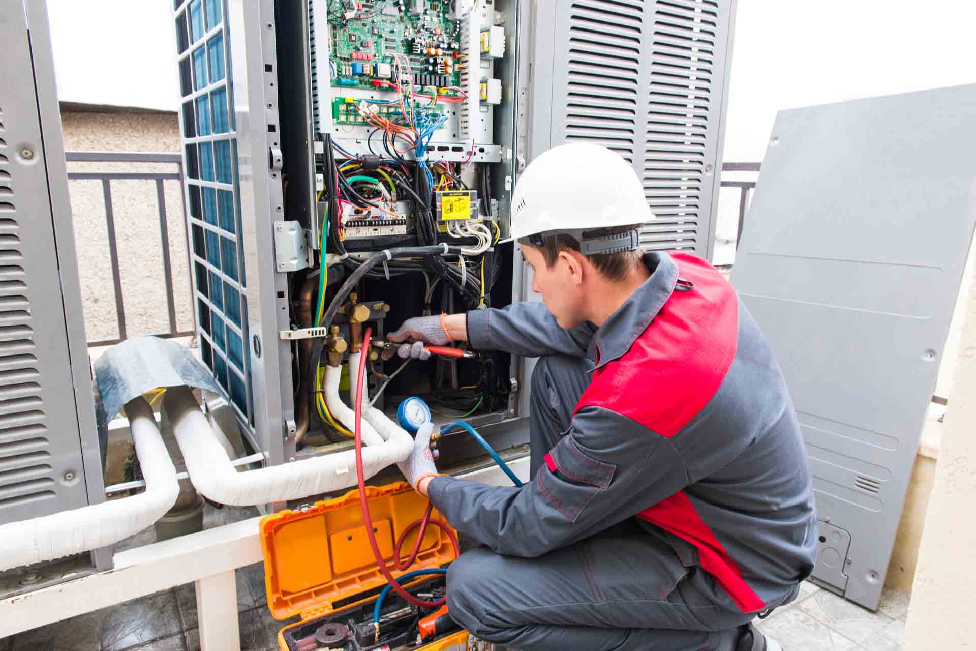 a technician repairing chiller