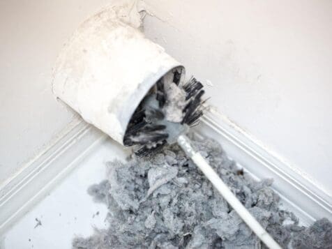 Brush and auger cleaning lint from dryer vent - Copy