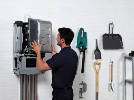 an hvac expert repairing home boiler system.